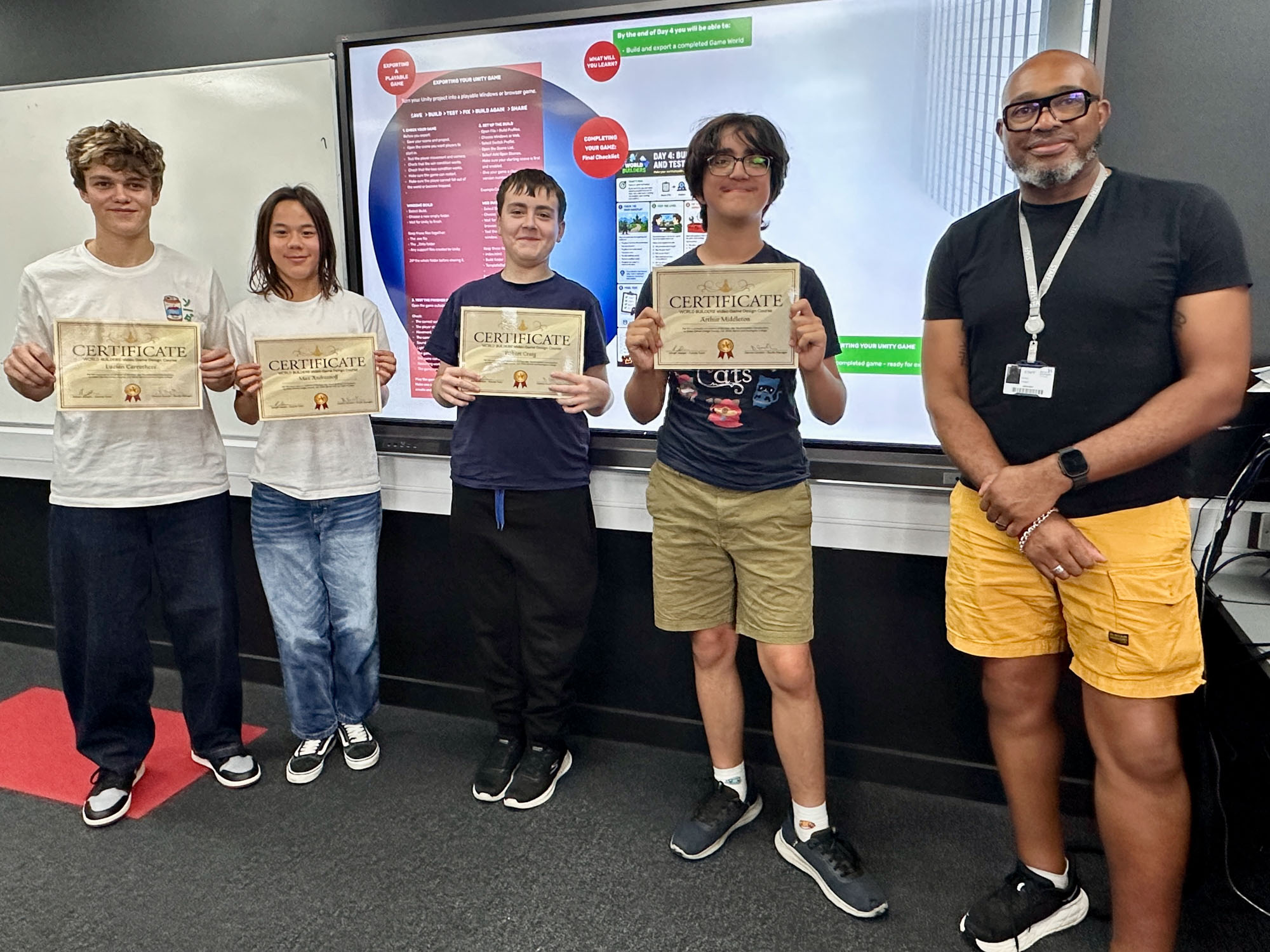 World Builder student holding their certificates after completing the course.